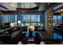 Contemporary living room offering city views, marble flooring, comfortable seating, and sleek modern design at 4575 Dean Martin Dr # 1909, Las Vegas, NV 89103