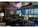Modern living room featuring a city view, marble floors, ambient lighting, and a cozy seating arrangement at 4575 Dean Martin Dr # 1909, Las Vegas, NV 89103