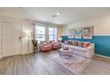 Sunlit living room showcasing stylish furnishings and decor at 5011 Sage Mesa Ave # Lot 143, Las Vegas, NV 89139