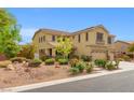 Attractive home featuring a well-maintained yard with landscaping and a three car garage at 6335 Iginlas Goal Ave, Las Vegas, NV 89131