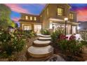 Charming home with stone walkway and lush rose bushes leading to a welcoming entryway at 6335 Iginlas Goal Ave, Las Vegas, NV 89131