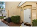 Welcoming front entrance with desert-friendly landscaping that provides curb appeal and easy maintenance at 6576 Buster Brown Ave # 101, Las Vegas, NV 89122