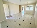 Spacious open-concept room featuring tile flooring and natural light at 7607 Pioneer Ranch Ave, Las Vegas, NV 89113