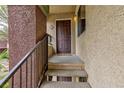 Apartment entryway featuring a covered porch, the unit number, and secure, dark-brown door at 7885 W Flamingo Rd # 2005, Las Vegas, NV 89147