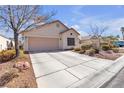 Charming single-story home features a neutral exterior and well-maintained landscaping at 9562 Collinsleap Ct, Las Vegas, NV 89123