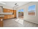 Eat in kitchen area features hardwood floors, a window and a sliding glass door to the backyard at , Las Vegas, NV 89149