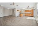 Open kitchen and living area with hardwood floors and abundant natural light at , Las Vegas, NV 89149