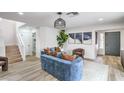 Stylish living room featuring modern furnishings, wood-look floors, and ample natural light at 10009 Coral Sands Dr, Las Vegas, NV 89117