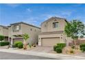 Attractive stucco home with a two-car garage and tiled roof in a residential neighborhood at 1014 Solemn Cactus Ave, North Las Vegas, NV 89031