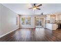 Bright and airy living room with a view of the backyard and an open floorplan at 10166 Monks Hood Ct, Las Vegas, NV 89183
