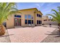 Spacious backyard featuring a brick patio, perfect for outdoor dining and entertaining with a barbecue at 1421 Via Savona Dr, Henderson, NV 89052