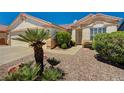 Charming single-story house with desert landscaping and a sidewalk leading to the front door at 1574 Livingston Dr, Henderson, NV 89012