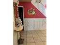 Elegant entryway with ornate mirror, console table, and decorative wall art at 1853 Citroen St, Las Vegas, NV 89142
