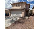 A cozy two-story house with a two-car garage and a red tile roof at 2130 Dragonslayer Ave, Las Vegas, NV 89183
