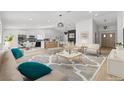 Bright, open living space with modern furnishings, hardwood floors, and a seamless flow to the kitchen at 2620 E Harmon Ave, Las Vegas, NV 89121