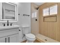 Updated bathroom featuring a modern vanity with sleek fixtures and a walk-in shower with stylish tile work at 2721 Bruce Cir, North Las Vegas, NV 89030