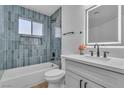 Charming bathroom featuring tub with modern fixtures, a stylish vanity, and an illuminated mirror at 2721 Bruce Cir, North Las Vegas, NV 89030