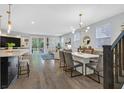 Open-concept living area with seamless flow from dining room to the outside patio, featuring modern decor at 3171 Biccari Ave, Henderson, NV 89044