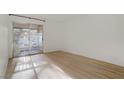 Bright, open room with a sliding glass door and modern flooring at 4310 Sandy River Dr # 70, Las Vegas, NV 89103