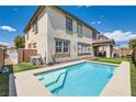 Inviting backyard features a refreshing pool and well-maintained landscaping, perfect for outdoor enjoyment at 5920 Big Horn View St, North Las Vegas, NV 89031