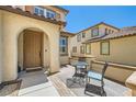 Inviting front porch featuring a cozy seating area, perfect for enjoying the outdoors at 5920 Big Horn View St, North Las Vegas, NV 89031