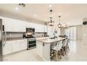Modern kitchen boasts sleek countertops, stainless steel appliances, and ample cabinet space at 5920 Big Horn View St, North Las Vegas, NV 89031