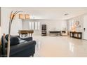 Bright and spacious living room with tile flooring and an abundance of natural light at 5920 Big Horn View St, North Las Vegas, NV 89031