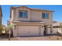 Charming two-story house showcasing a tile roof, two-car garage, and a well-maintained front yard at 6713 Violet Cascade Ave, Las Vegas, NV 89156