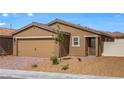 Single story home featuring a two car garage, desert landscaping, and neutral color palette at 6719 Violet Cascade Ave, Las Vegas, NV 89156