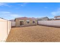 Spacious backyard fully enclosed with vinyl fencing and a low-maintenance gravel ground cover at 6737 Lotus Vista Ct, Las Vegas, NV 89156