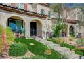 Charming townhome featuring an arched entrance, and stone stairway at 759 Pickled Pepper Pl, Henderson, NV 89011
