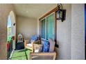 Inviting patio with comfortable seating, decorative pillows, and stylish decor at 759 Pickled Pepper Pl, Henderson, NV 89011