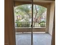 A balcony with a view of lush greenery and community landscape at 7885 W Flamingo Rd # 1064, Las Vegas, NV 89147