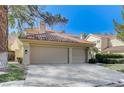 This beautiful home has a spacious two-car garage and manicured landscaping at 8121 Castle Pines Ave, Las Vegas, NV 89113