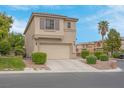 Attractive two-story home with a two-car garage and well-kept landscaping at 10630 Lunar Crest Ave, Las Vegas, NV 89129
