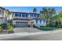 Spacious two-story home with a three-car garage and well-maintained lawn at 1353 Volturno Way, Henderson, NV 89052
