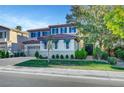 Charming two-story home with well-maintained landscaping, a beautiful lawn, and a two-car garage at 1353 Volturno Way, Henderson, NV 89052
