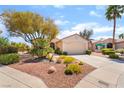 Charming single-story home featuring a xeriscaped front yard and a two-car garage at 1781 Cypress Lake Ct, Henderson, NV 89012