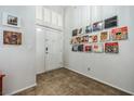 Inviting entryway featuring tiled flooring and curated wall art, creating a welcoming atmosphere at 271 Sunshine Springs Ct, Henderson, NV 89014
