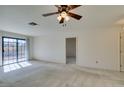Bright, open bedroom featuring neutral carpet and a glass sliding door at 2851 S Valley View Blvd # 1161, Las Vegas, NV 89102