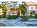 Condominium with a well-kept lawn and a walkway leading to the building at 2851 S Valley View Blvd # 1161, Las Vegas, NV 89102
