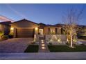 Charming single story home with meticulously landscaped front yard and brick driveway at 33 Desert Juniper Ln, Henderson, NV 89011