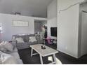 Comfortable living room with gray couches, neutral walls, and natural light throughout the home at 3512 Trilogy Dr, Las Vegas, NV 89108