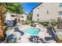 Community hot tub surrounded by lush landscaping and decorative boulders at 4200 S Valley View Blvd # 3078, Las Vegas, NV 89103
