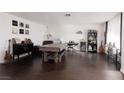 Spacious living room boasts hardwood floors and ample room for entertaining, with a small entertainment center at 4509 Paseo Del Ray Dr, Las Vegas, NV 89121