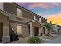 Charming townhouse exterior featuring desert landscaping and an inviting covered front porch at 4612 Townwall St, Las Vegas, NV 89115