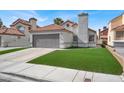 Inviting home featuring a 2-car garage, red tile roof, chimney, and lush artificial lawn at 5762 Yerington Ave, Las Vegas, NV 89110