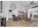 Bright living room with hardwood floors, modern decor, and an open layout at 656 Thornewood Pl, Las Vegas, NV 89123