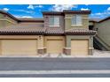 Street view of condo garages, neutral paint and stone accents at 6868 Sky Pointe Dr # 1089, Las Vegas, NV 89131