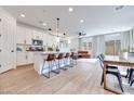 Bright, open-concept space featuring tile floors, a modern kitchen, and comfortable living area at 764 Aurora Vale Pl, Henderson, NV 89011